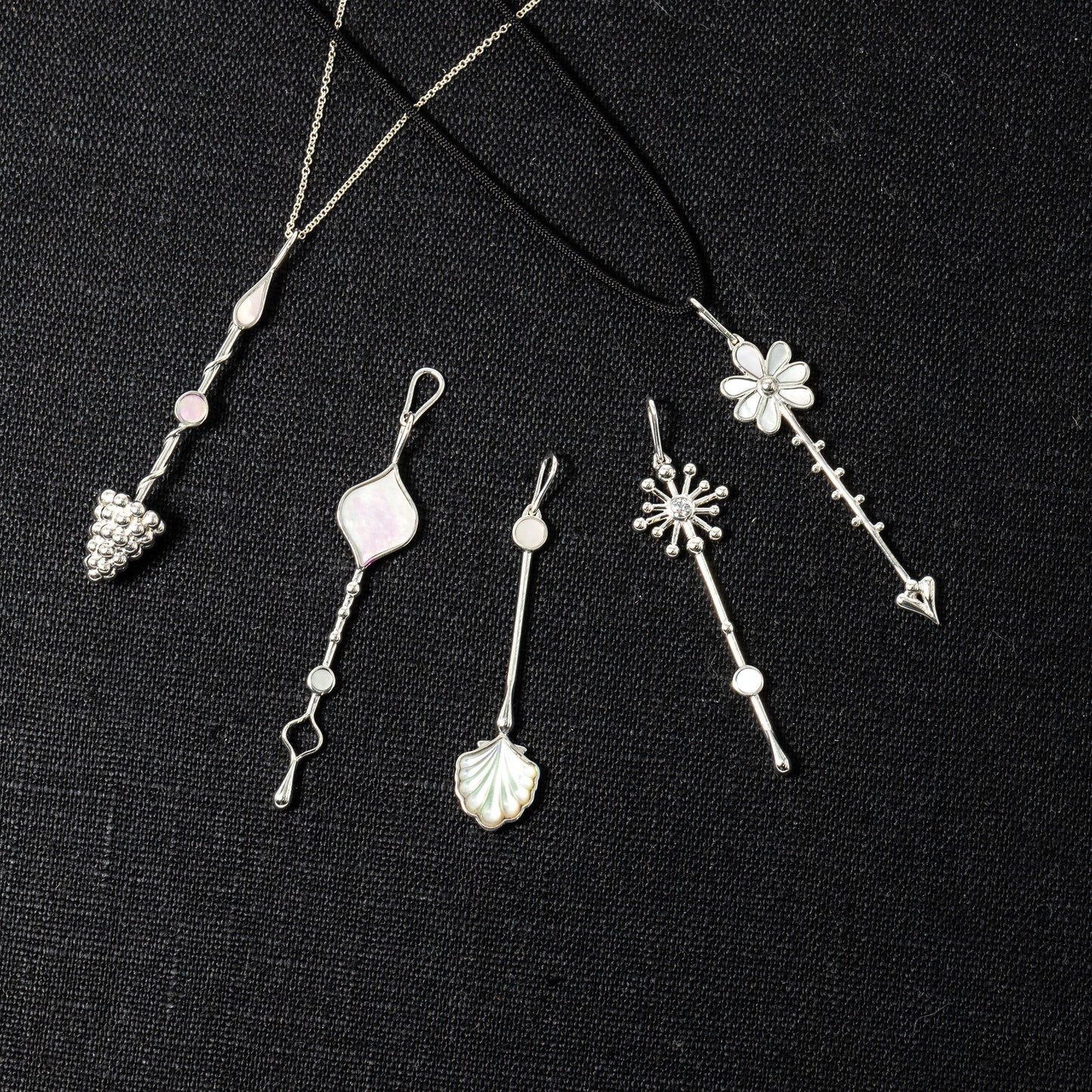 Multiple Wand pendants in sterling silver with mother-of-pearl displayed together
