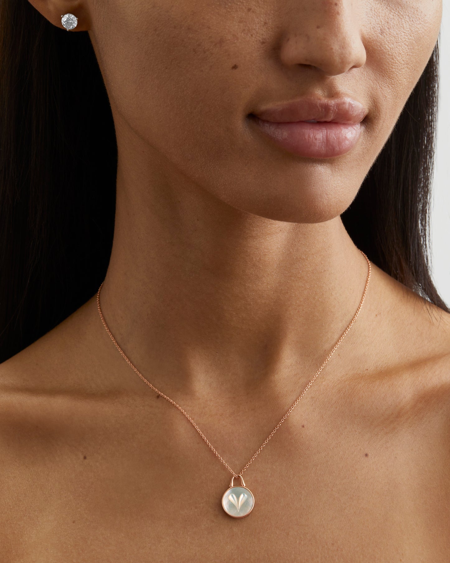 Roseate Cameo 12mm heart pendant in sterling silver with mother-of-pearl worn on a model