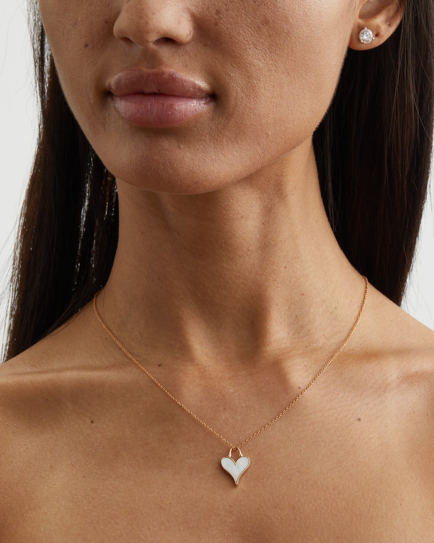 Roseate LoveLock 12mm pendant in 18k yellow gold with mother-of-pearl worn on a model