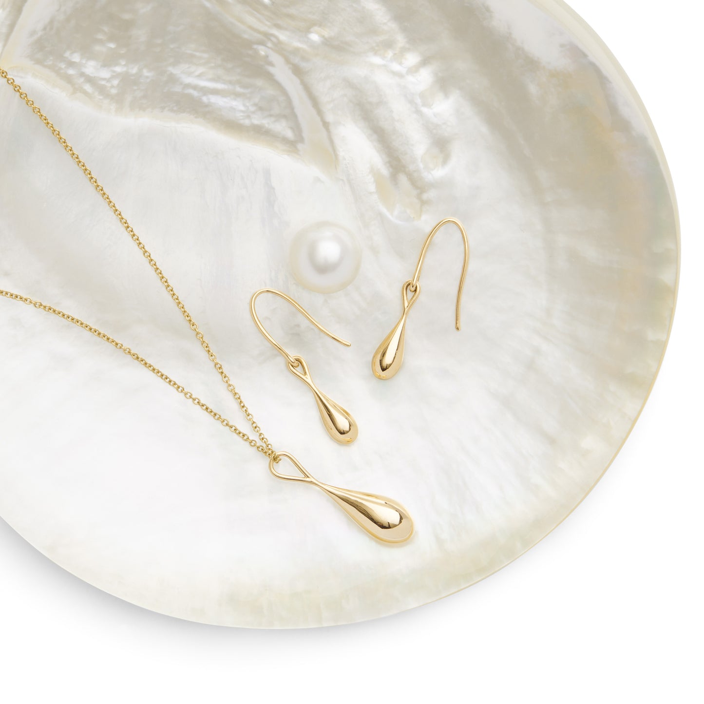 Roseate WaterDrop large pendant in 14k yellow gold with mother-of-pearl styled in context