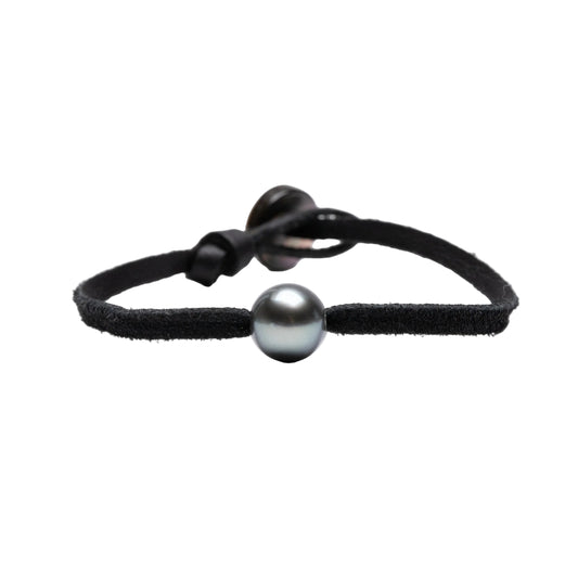 Kamoka Tahitian pearl bracelet on a black leather cord and mother-of-pearl button closure.  