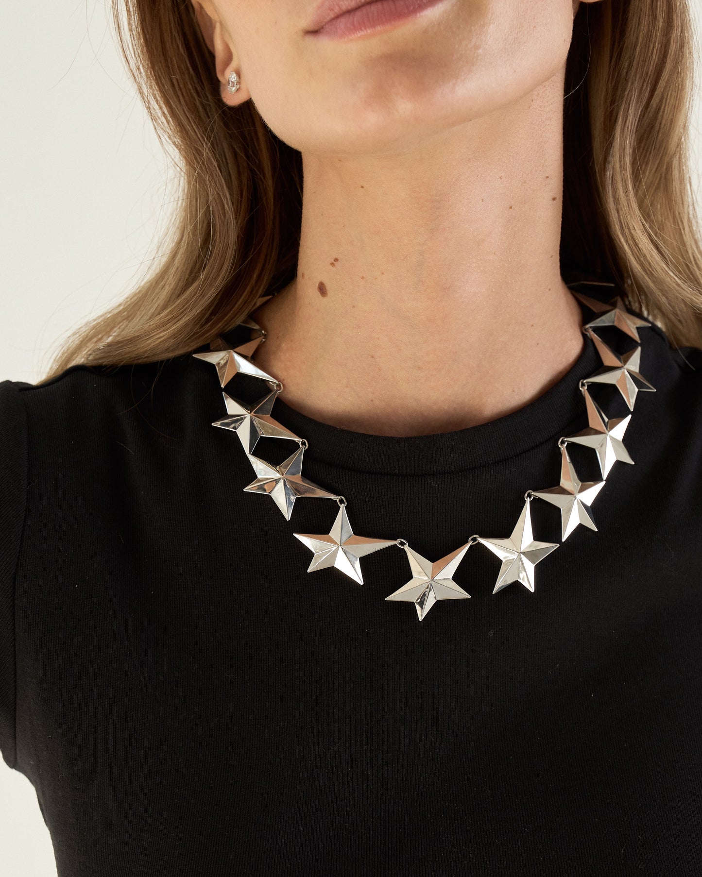 Angela Cummings large Star necklace in sterling silver shown on neckline