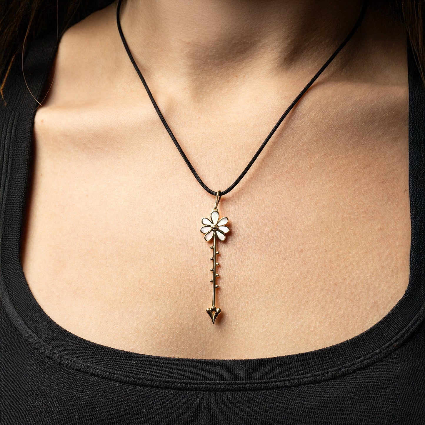 Bloom Wand Pendant in 18K rose gold with luminous mother-of-pearl on a silk cord on model