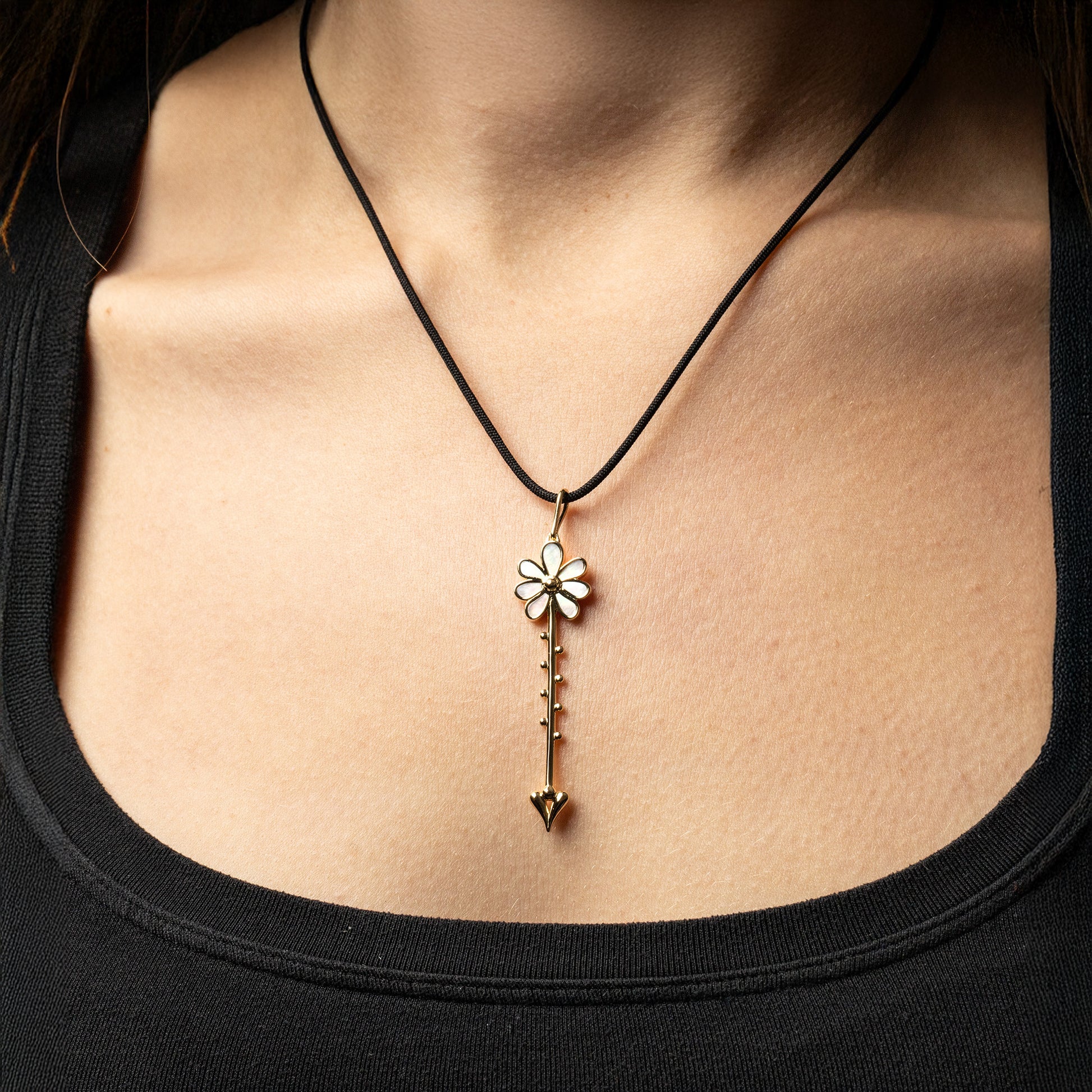 Bloom Wand Pendant in 18K rose gold with luminous mother-of-pearl on a silk cord on model