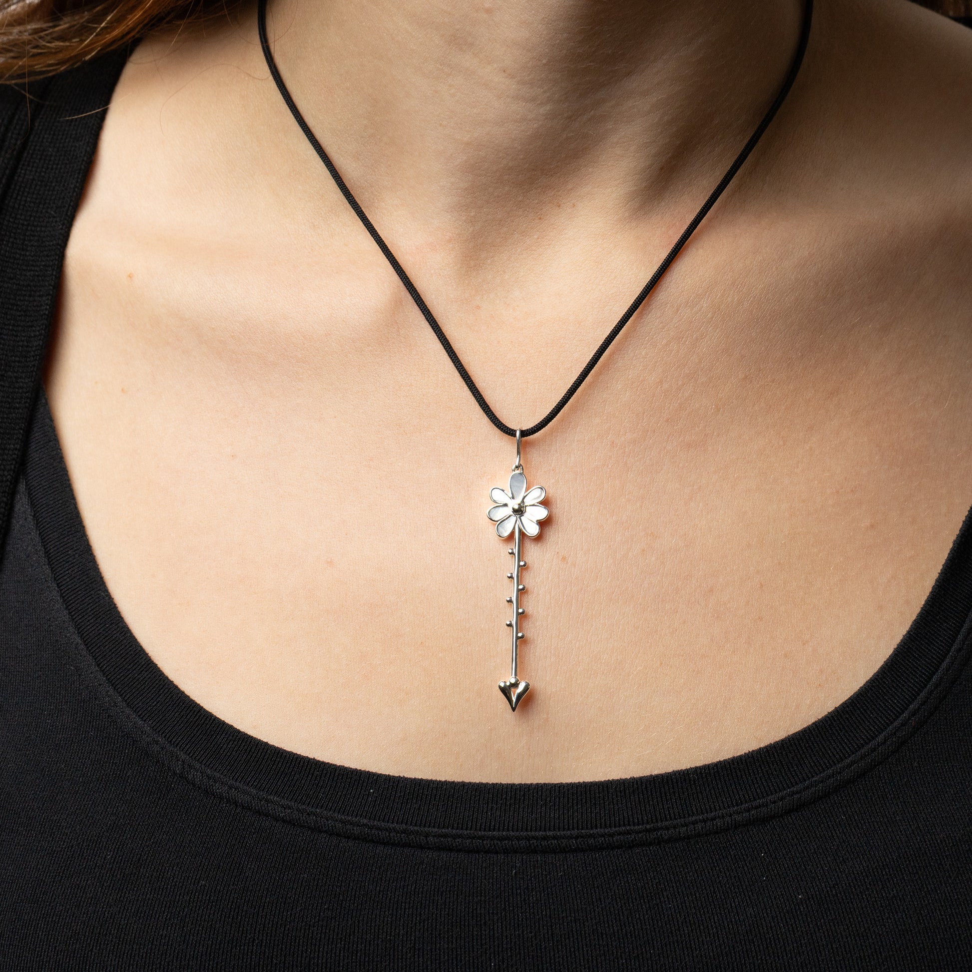 Bloom Wand Pendant in sterling silver with luminous mother-of-pearl on a silk cord worn on model