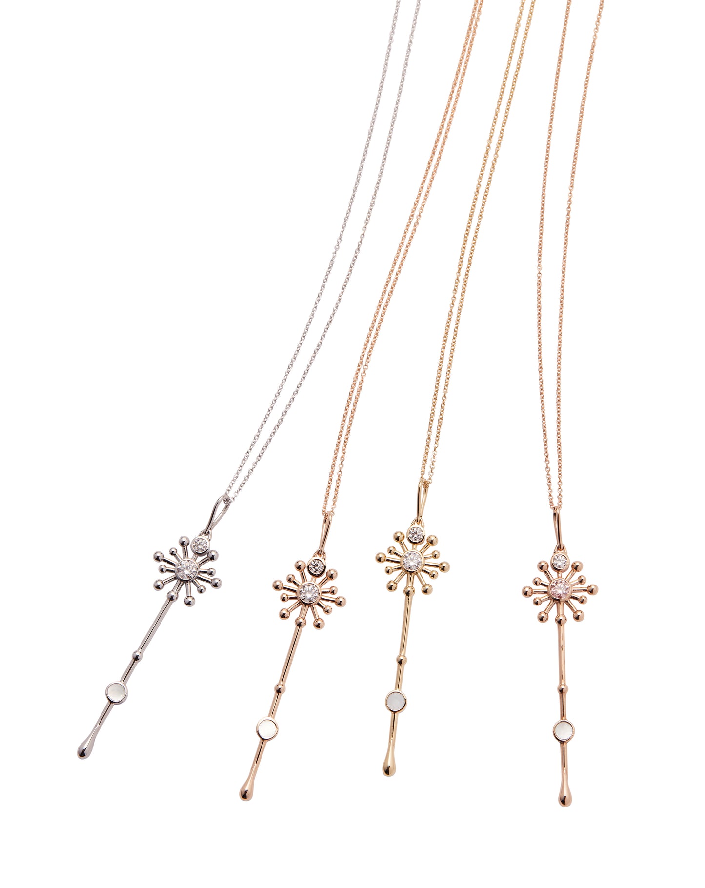 Four Light Wand pendants in 18K gold with luminous mother-of-pearl and lab-grown diamonds on chains