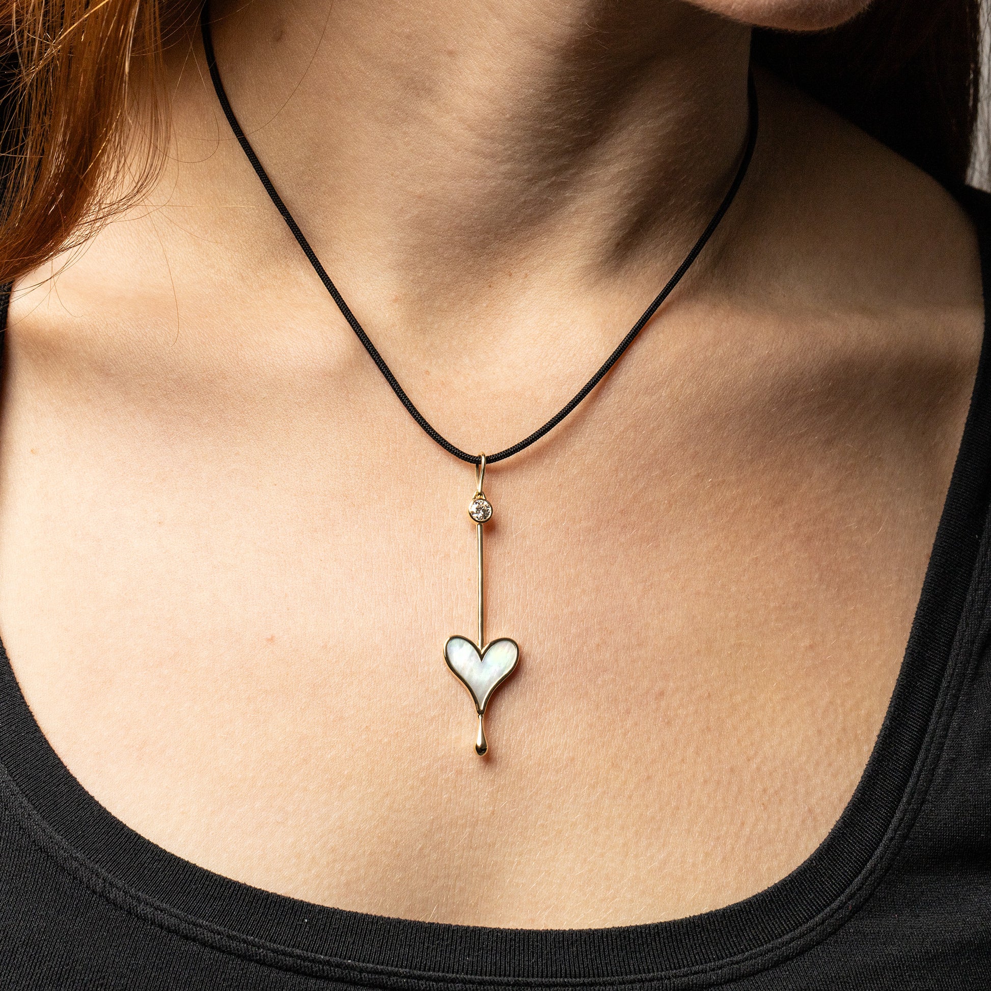 Love Wand Pendant in 18K rose gold with luminous mother-of-pearl and lab-grown diamond on a silk cord