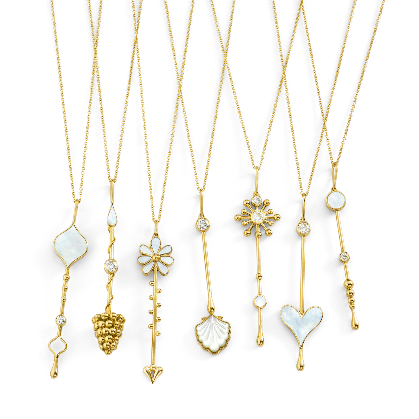 Multiple Love Wand pendants on chains in 18K yellow gold displayed against a white background
