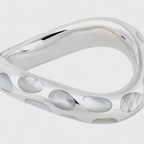 Video showing Angela Cummings Sterling Silver Wave Bangle in mother-of-pearl