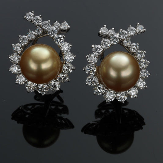 Vintage Angela Cummings for Assael earrings featuring round Golden South Sea cultured pearls surrounded by brilliant-cut diamonds in platinum and 18K white gold. Offered by Roseate.