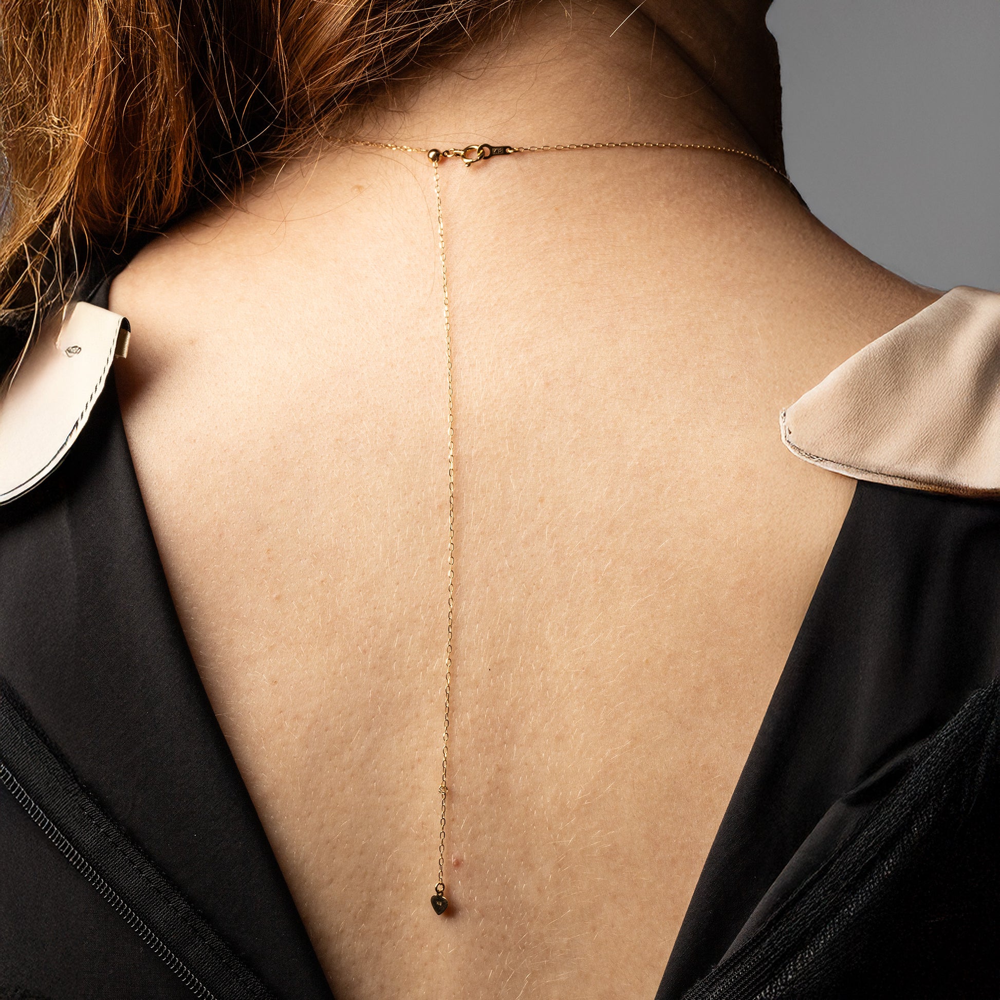Showing the back of the Roseate graduated Akoya cultured pearl Y-necklace in 18K yellow gold on model.