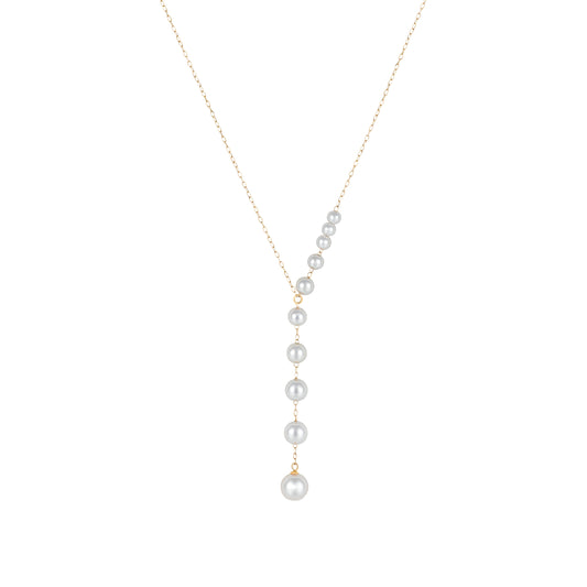 Graduated Akoya cultured pearl Y-necklace in 18K yellow gold featuring luminous white Akoya pearls that increase in size along a delicate gold chain, creating a modern feminine silhouette.
