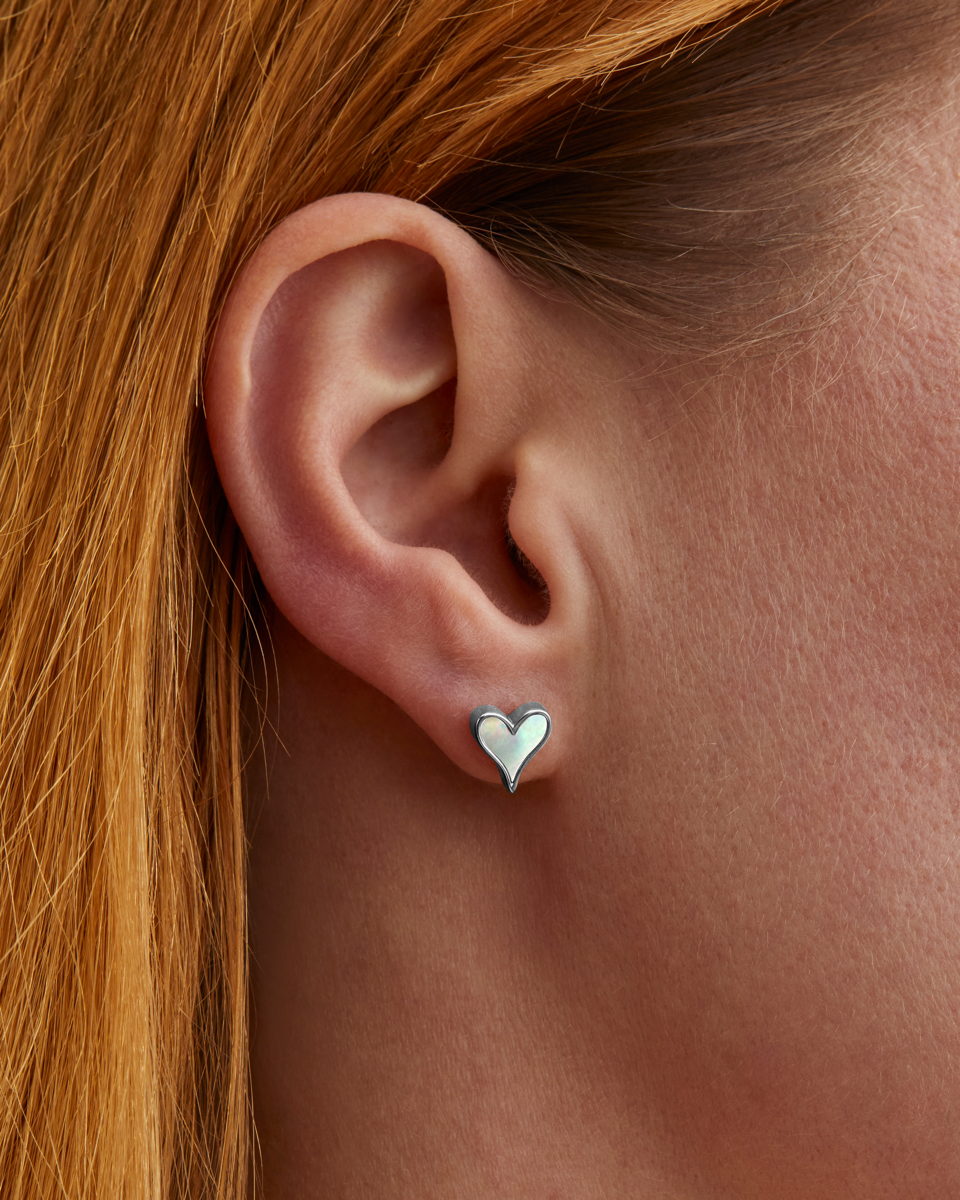 Roseate LoveLock 7mm earrings in sterling silver with mother-of-pearl worn on a model