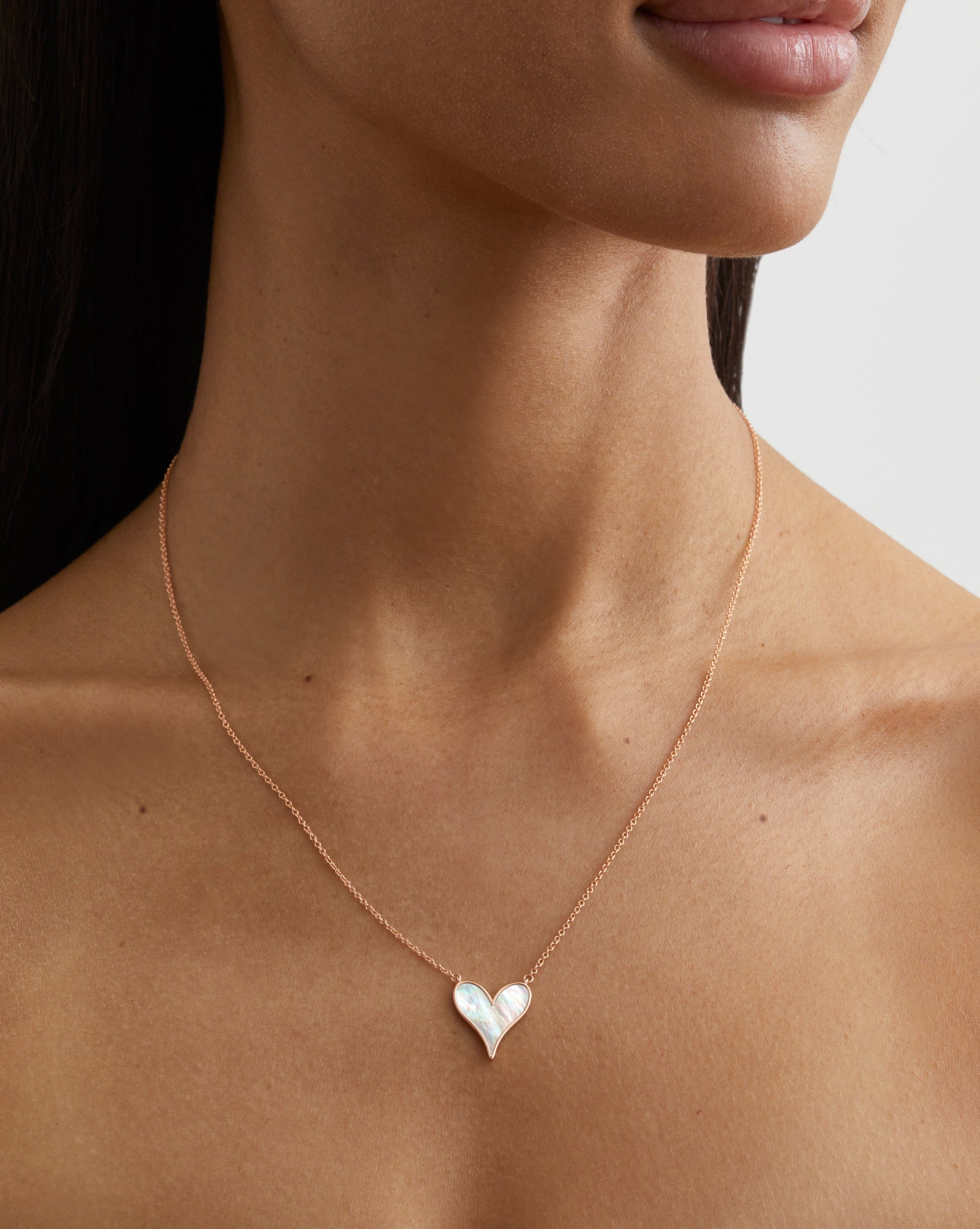 Roseate LoveLock 15mm pendant in 18k rose gold with mother-of-pearl worn on a model