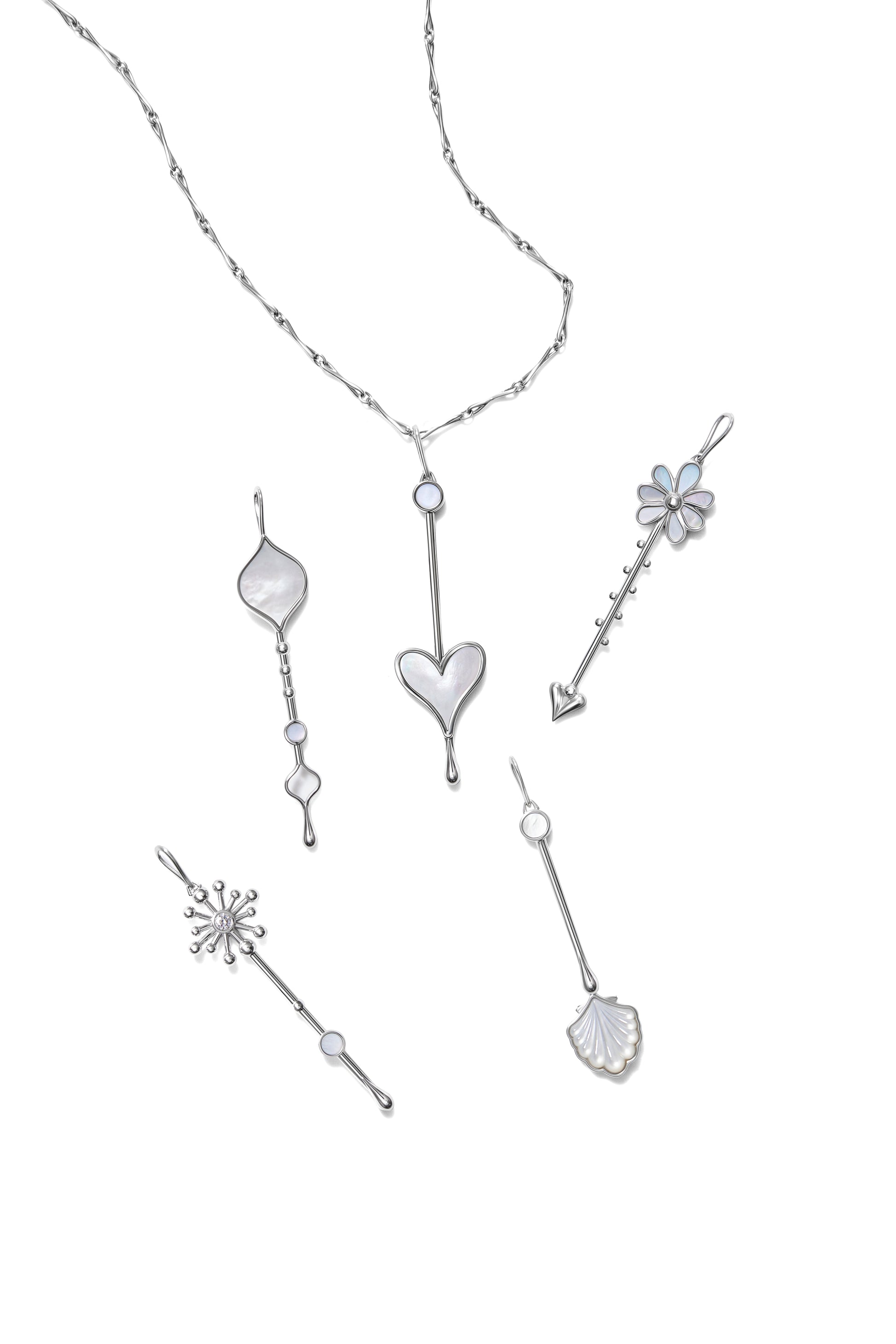 Multiple Wand pendants in sterling silver with mother-of-pearl displayed together on a white background