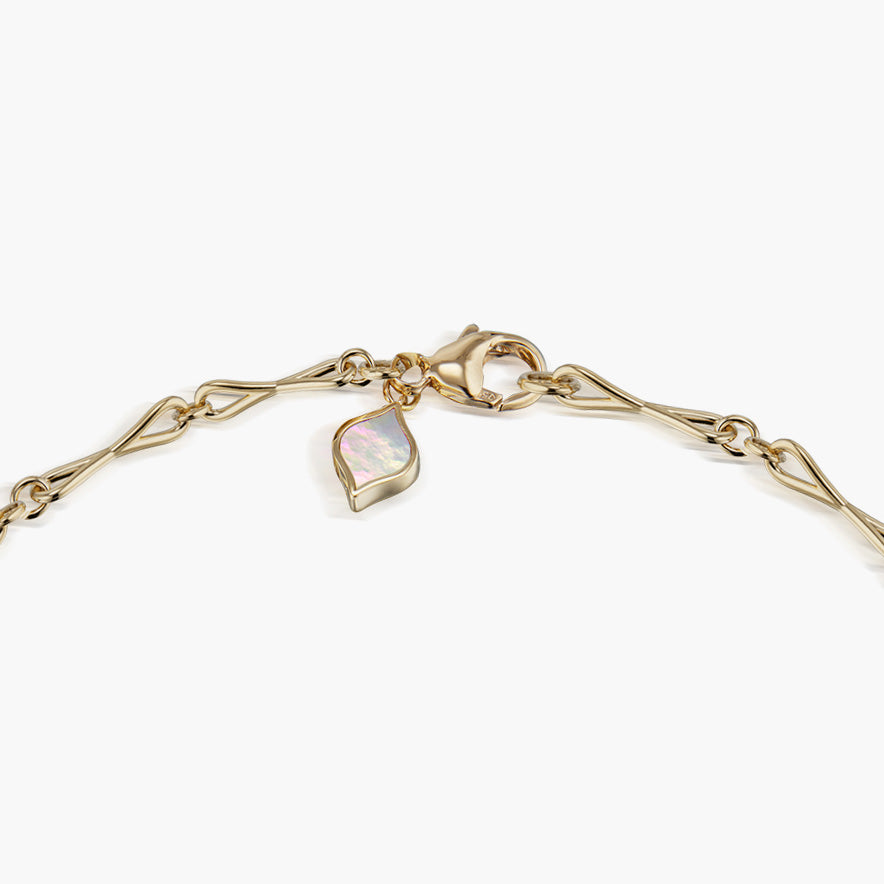 Close detail of Roseate WaterDrop medium link necklace in 14k yellow gold with mother-of-pearl