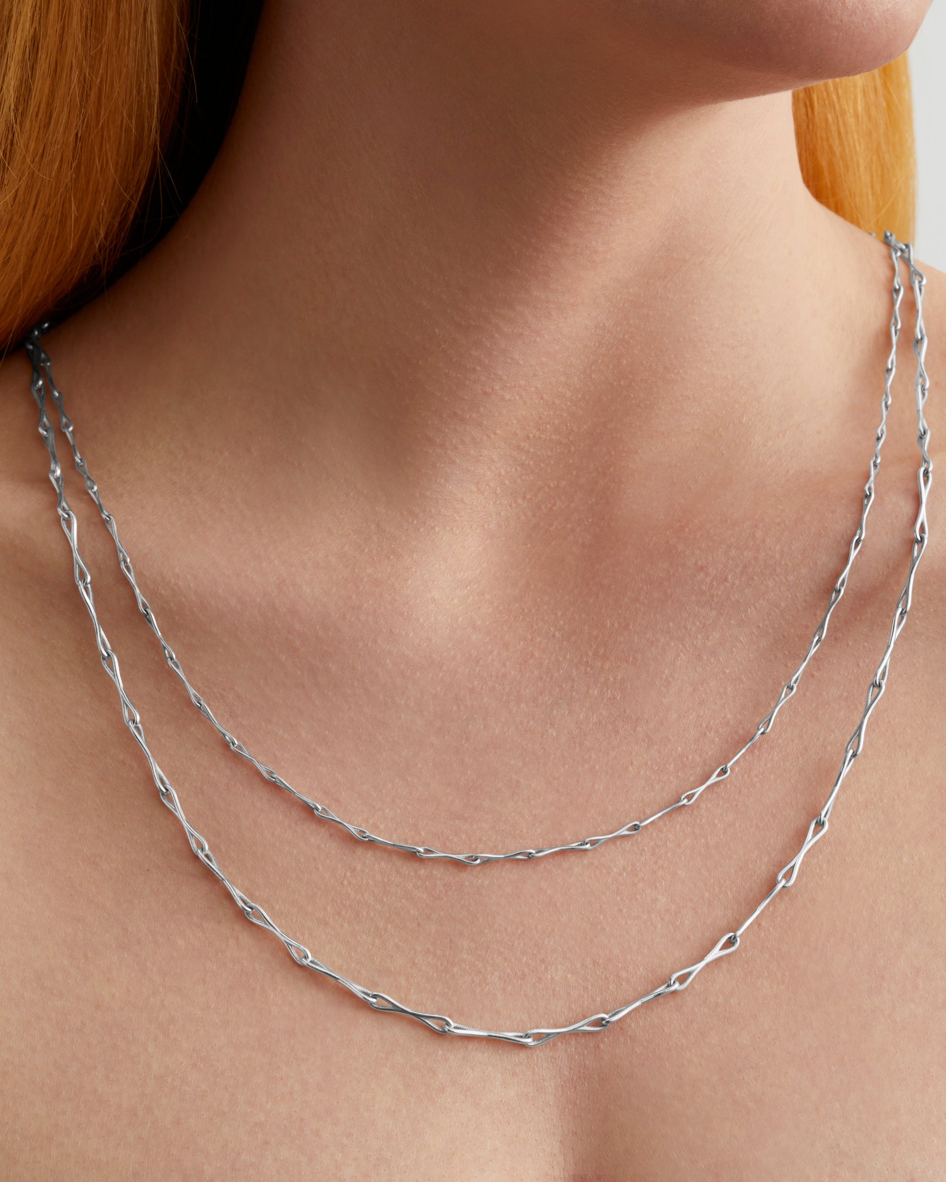 Roseate WaterDrop small link necklace in sterling silver with mother-of-pearl worn on a model