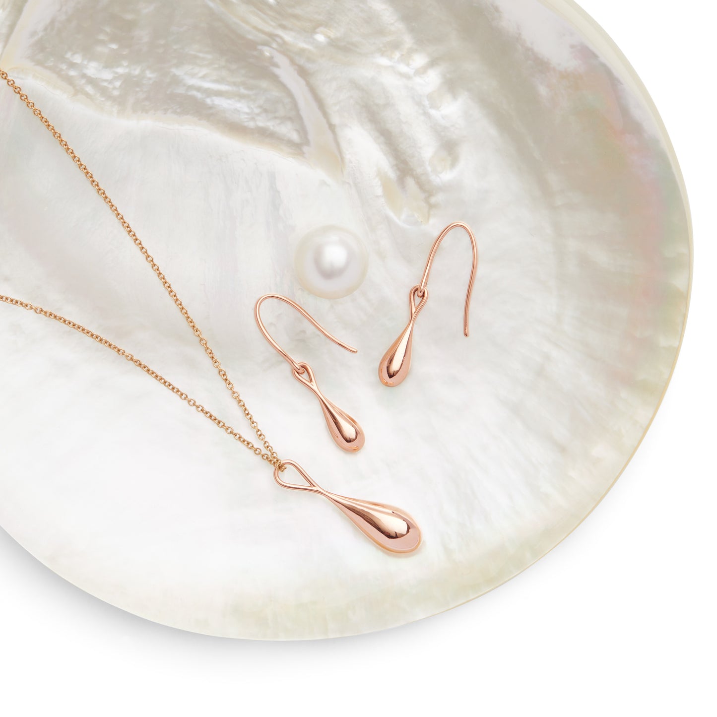 Roseate WaterDrop large pendant in 14k rose gold with mother-of-pearl styled in context