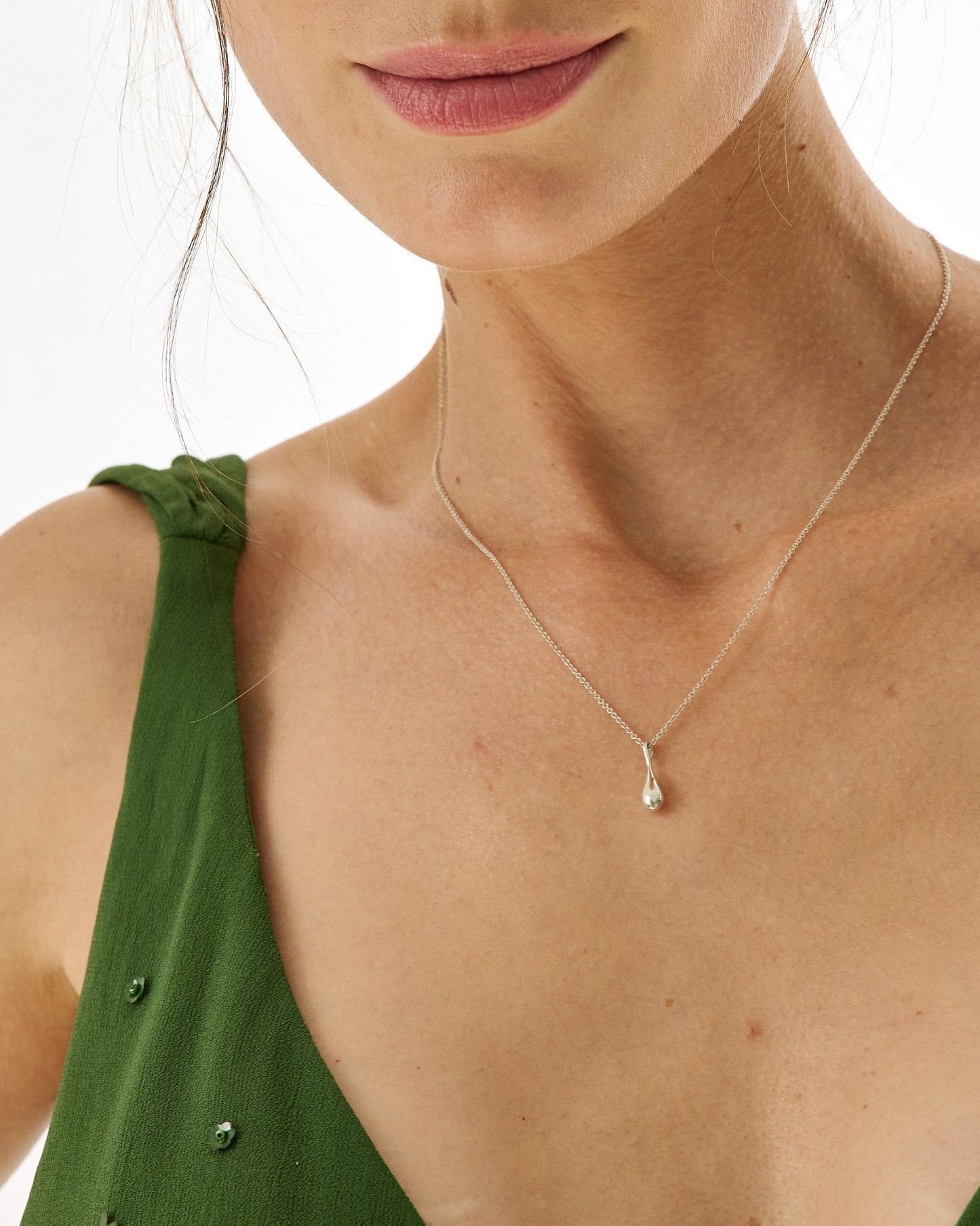 Roseate WaterDrop small pendant in sterling silver worn on a model