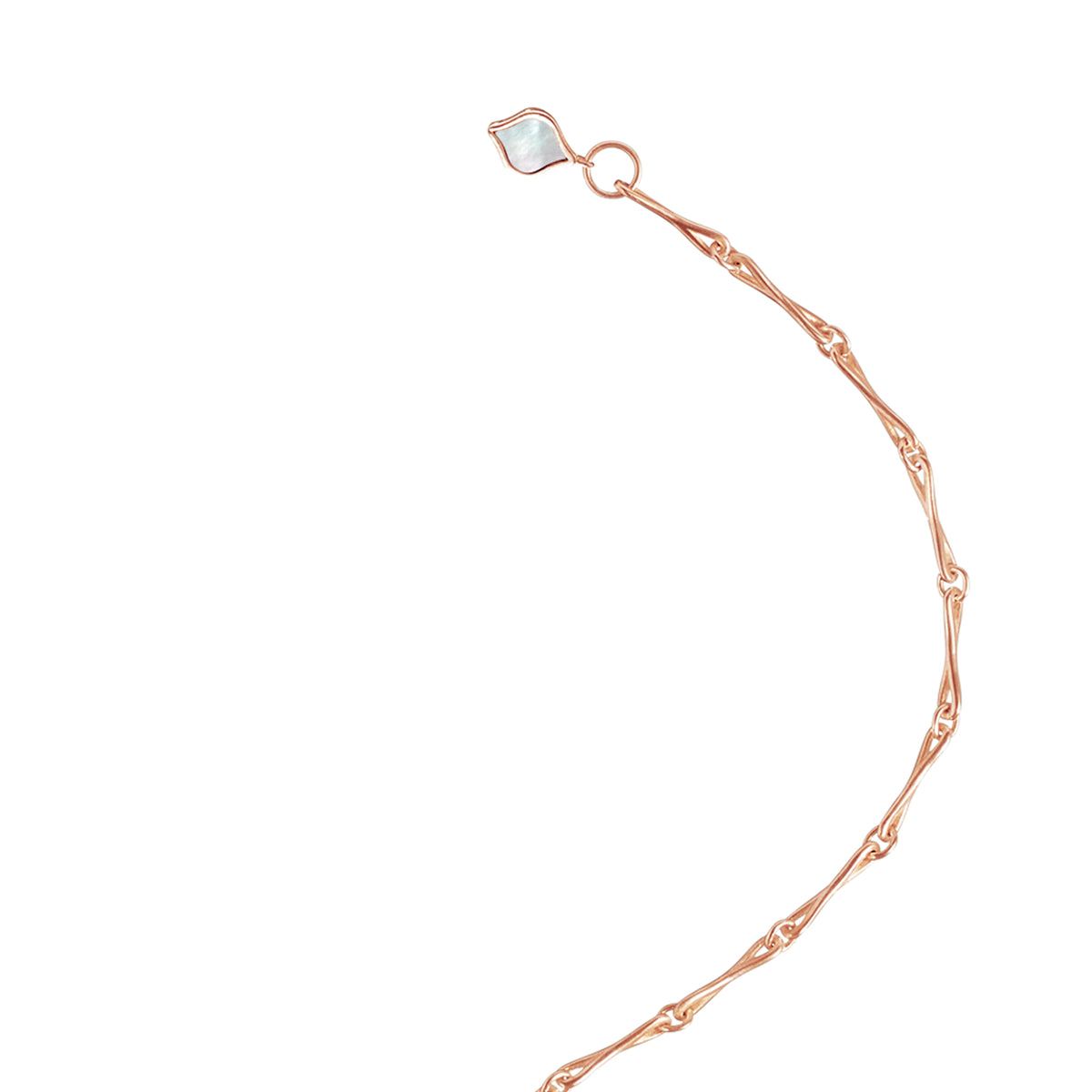 Close detail of the mother-of-pearl tag on the Roseate WaterDrop small link bracelet in 14k rose gold