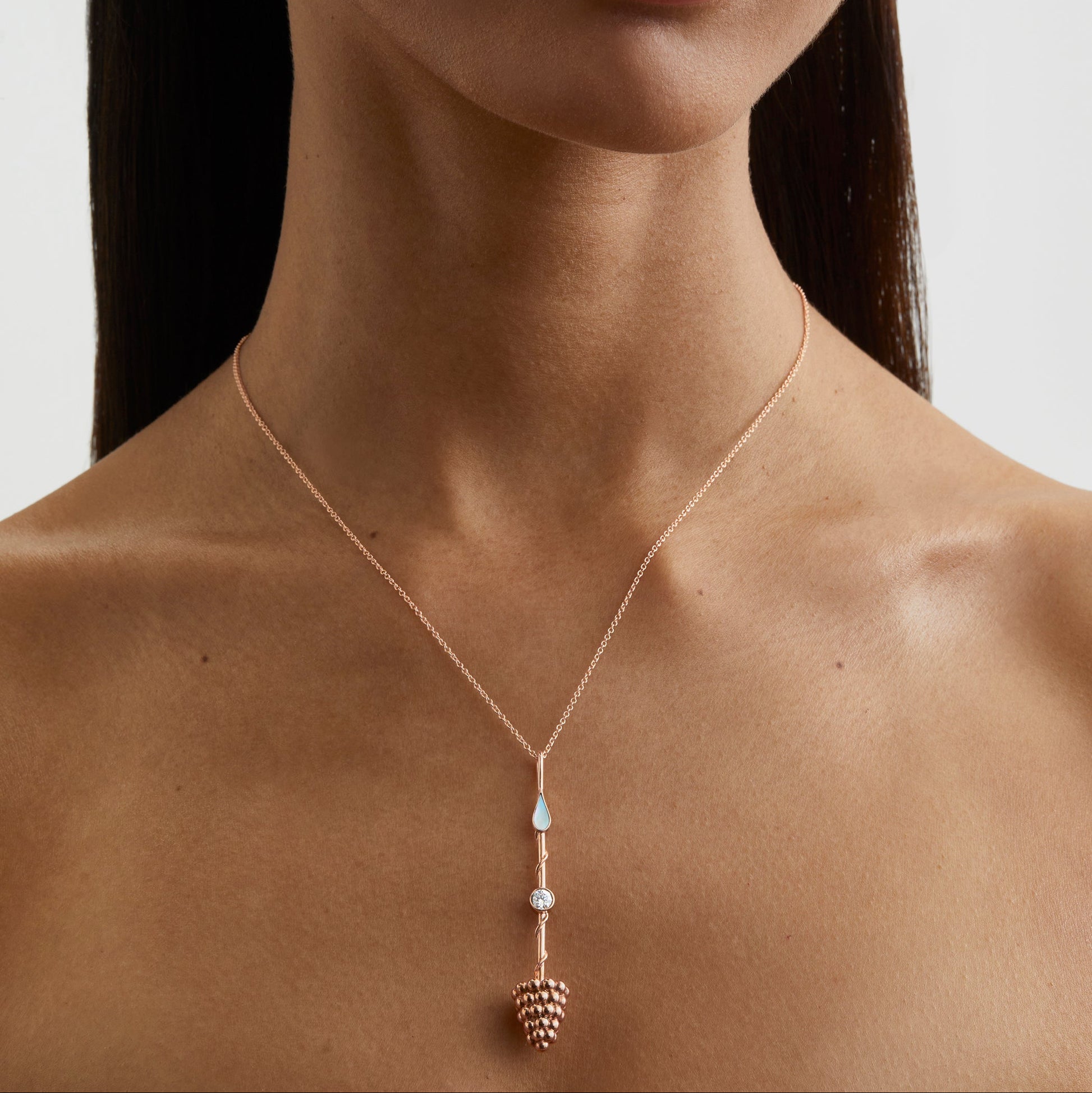 Prosperity Wand Pendant in 18K rose gold with luminous mother-of-pearl and a lab-grown diamond worn a model