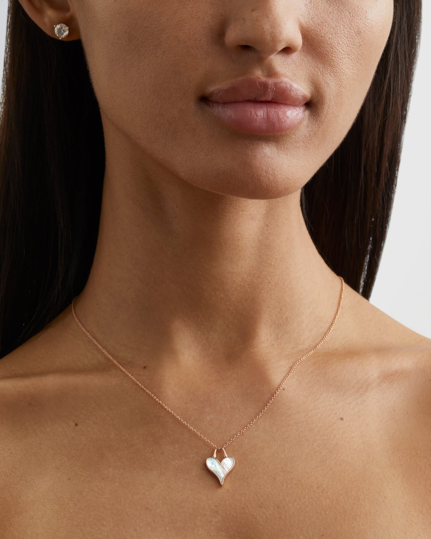 Roseate LoveLock 12mm pendant in 18k rose gold with mother-of-pearl worn on a model