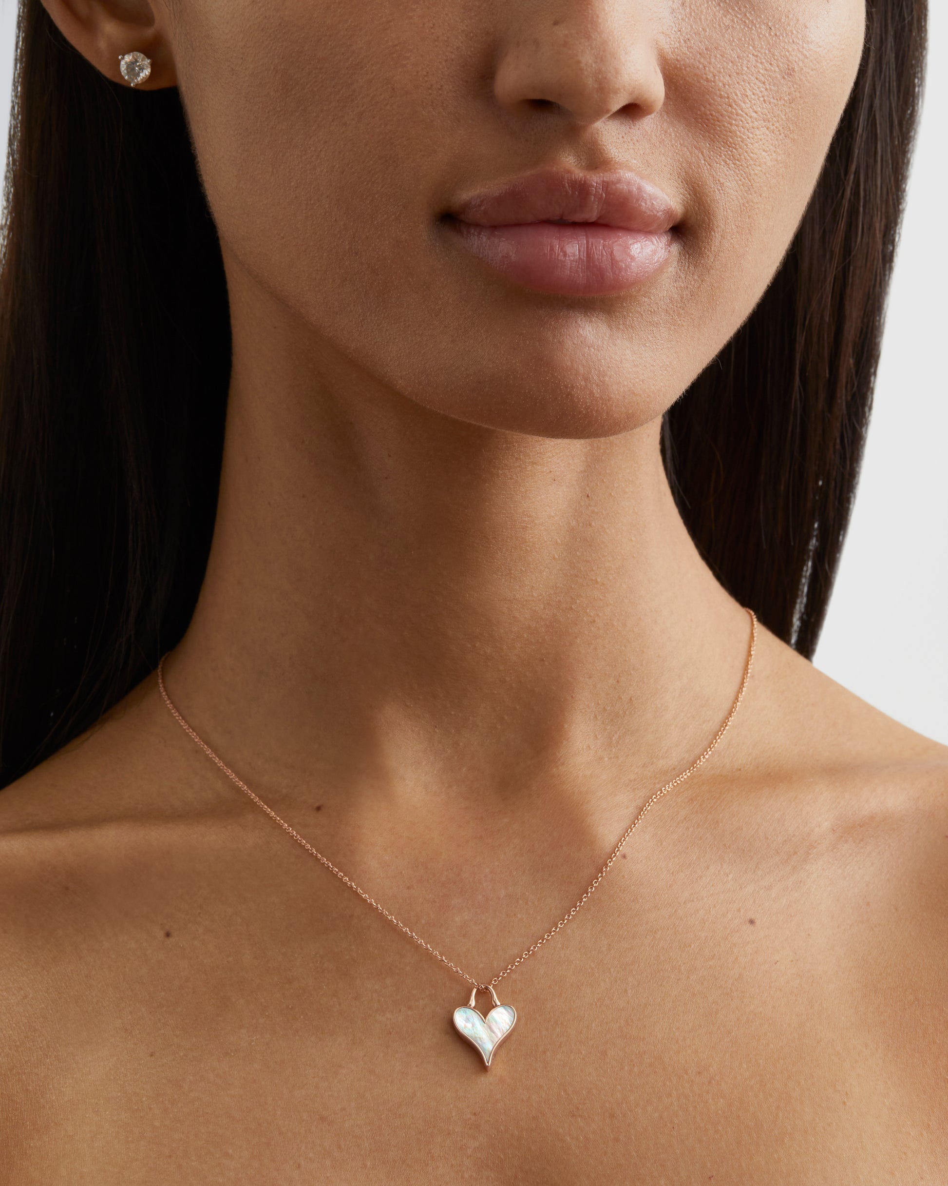 Roseate LoveLock 12mm pendant in 18k rose gold with mother-of-pearl worn on a model